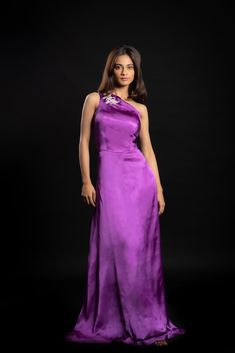 Indulge in sartorial bliss with the purple-coloured Enchanting Alchemist gown. The gown is made with cupro satin and is embellished with hand-crafted beadwork.Details Neckline: One shoulder Material: Cupro satin Lining: Cotton-polyester Made in India What makes this outfit sustainable?This outfit is made with cupro satin; the fabric is made from cotton linter waste. It is a sustainable alternative to polyester. Purple Silk Evening Dress, Purple Satin Evening Dress, Silk Purple Evening Dress, Festive Silk Evening Dress For Gala, Formal Purple Satin Evening Dress, Silk Gown With Bias Cut, Floor-length, Embellished Purple Evening Gown, Silk Floor-length Gown With Satin Finish, Festive Silk Gala Gown