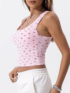 Crafted from a luxurious blend of 46% cotton, 46% rayon, and 8% spandex, this Cotton Rib Tank offers a soft touch and perfect stretch for all-day comfort. Featuring a square neck, fitted crop design, and chic contrast stitching, its double-layered breast area and removable pads provide ample support for bra-free wear. This versatile tank pairs seamlessly with yoga pants, shorts, skirts, jeans, and more, making it ideal for yoga, workouts, vacations, or casual wear. Transition easily from summer Pink Cotton Tank Top With Floral Print, Fitted Printed Pink Tank Top, Summer Tank Top With Built-in Bra And Square Neck, Fitted Pink Floral Print Bra, Crop Design, Square Neck Tank Top, Pink Floral Print V-neck Tank Top, Skirts Jeans, Yoga Workouts