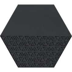 a black hexagonal object with geometric designs on the top and bottom, sitting in front of a white background