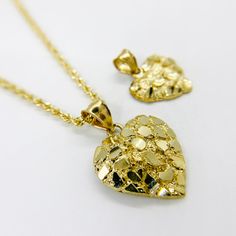 10k Solid Gold Nugget Heart Charm Pendant for Women/Girl * Metal : Real 10K Yellow Gold * Condition : Brand New * Finish : Polished * Width : X Small (12.8m) / Small (14.3mm) / Medium (19.1mm) / Large (25.9mm) * Weight : 1.1 ~ 3.7 gram This is an approximate size & weight. Please expect up to ±10% difference. * Necklace (optional) : 2.0mm Rope (hollow) * Processing time : 1~3 business days * Ships from California This is 100% Authentic 10k Gold. Not plated or filled. All of our items are brand n Gold Nugget Heart Necklace, Gold Nugget Necklace, Girls Unique, Nugget Necklace, Love Jewelry, Gold Nugget, Charm Pendant Necklace, Unique Gifts For Her, Accessories Jewelry Necklace