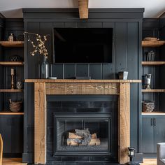 a living room filled with furniture and a flat screen tv mounted above a fire place