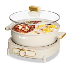 a white crock pot filled with food on top of a counter next to a glass lid