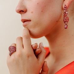 Long earrings can add a touch of elegance and glamour to any outfit, especially when dressing up for a night out. These beautiful fuchsia earrings are a perfect example of how accessories can enhance your overall look. The bold color of these earrings will make them stand out and draw attention to your face, while the length will add a sense of drama and sophistication. When wearing long earrings, it's important to keep the rest of your jewelry minimal so that the earrings can be the star of the Luxury Jeweled Earrings For Formal Occasions, Luxury Gemstone Earrings For Party, Red Single Earring Fine Jewelry, Red Single Earring For Evening, Formal Jewel Earrings Fine Jewelry, Elegant Red Earrings For Party, Ruby Teardrop Earrings For Party, Formal Fine Jewelry Earrings With Jewels, Luxury Jeweled Earrings For Evening