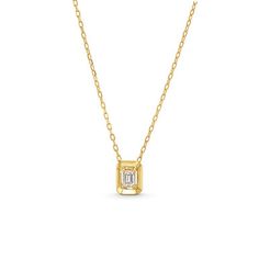 This Emerald Gold Frame Solitaire Pendant Necklace features an emerald cut diamond totaling approximately 0.21 carats framed in 18K yellow gold. 14k Gold Emerald Cut Solitaire Necklace, Timeless 14k Gold Emerald Cut Solitaire Necklace, Emerald Cut Solitaire Necklace In 14k Gold, 14k Gold Necklace With Emerald Cut Diamond Accents, Timeless 14k Gold Emerald-cut Necklace, Gold Radiant Cut Diamond Necklace, Gold Radiant Cut Necklace Fine Jewelry, Yellow Gold Radiant Cut Necklace For Formal Occasions, Radiant Cut Yellow Gold Necklace For Formal Occasions