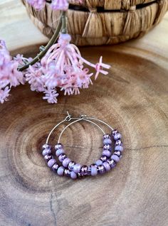 Pretty, purple amethyst colored Czech seed beads. Stainless steel hoops are lightweight and are 30mm big (1.18 inch) hypoallergenic    Keep your jewelry dry!!  Will be shipped in a organza bag for gifting or storing.  Please message with any requests or questions thank you. Boho Beaded Earrings, Boho Hoop Earrings, Earrings Purple, Amethyst Color, Pretty Purple, Or Questions, Beaded Hoop Earrings, Beaded Hoops, Earrings Boho