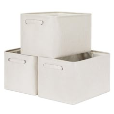 three canvas storage bins with handles on each side, one white and the other beige