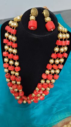 Coral bead necklaces are demanding and lovable jewellery by Women. They are the all time favourite jewelley of most of the women. This is a Coral and pearl necklace and is gorgeous with three lines and hinged with microgold plated hinges. The necklace is adjustable. Festive Multi-strand Gold Beaded Jewelry, Formal Multi-strand Faceted Bead Jewelry, Festive Multi-strand Jewelry With Gold Beads, Handmade Elegant Beads For Festivals, Elegant Handmade Beads For Festivals, Multi-strand Gold Beads Costume Jewelry, Gold Multi-strand Jewelry For Festivals, Elegant Faceted Beads Jewelry For Festivals, Elegant Jewelry With Faceted Beads For Festivals