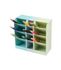 three different colored pencils are in the holder