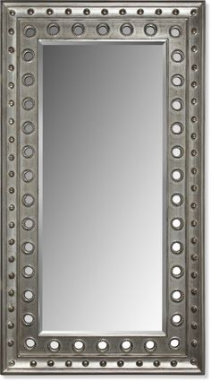 a silver framed mirror with circles and dots on the border, in front of a white background