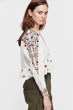 Free People Ava Embroidery Blouse - Ivory – shophearts Spring Long Sleeve Tops With Embroidered Sleeves, Long Sleeve Embroidered Top With Floral Design For Summer, Long Sleeve Blouse With Floral Embroidery For Fall, Summer Long Sleeve Embroidered Top With Floral Print, Summer Long Sleeve Floral Embroidered Top, Folk Style Long Sleeve Tops For Spring, Folk Style Long Sleeve Peasant Top For Fall, Fall Folk Style Long Sleeve Peasant Top, White Blouse With Embroidered Sleeves For Fall