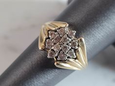 A WOMENS VINTAGE ESTATE 14K GOLD DIAMOND CLUSTER RING.  THE RING IS A SIZE 6.25 AND WEIGHS 4.3g.  THERE ARE ABOUT .26cts OF DIAMONDS IN THIS RING.  THE RING MAKES A BEAUTIFUL, IMPRESSIVE GIFT FOR THAT SOMEONE SPECIAL.  ANY OTHER QUESTIONS, PLEASE ASK.  BE SURE TO CHECK OUT SOME OF MY OTHER GREAT ITEMS UP FOR SALE. THANK YOU. Gold Heart Bracelet, Silver Horse, Diamond Cluster Ring, Diamond Cluster, Heart Bracelet, Cluster Ring, Womens Jewelry Rings, Someone Special, Gold Diamond