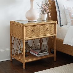 a rattan side table is on sale for $ 599 at ballard's