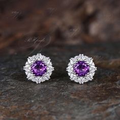 Product Detail Material: 925 Sterling Silver, 10k/14k/18k Solid Rose/White/Yellow Gold, Platinum Quantity: 2pcs (a pair) earrings Center Stone: 6.5mm Round Cut Natural Amethyst Side Stones: Marquise Cut and Round Cut Moissanites Custom Service 1, Gemstones can be replaced with others. 2, All metal can be customized. 3, The earrings can be customized according to the design you want. Please contact us if you need any personalized custom earrings. We will try our best to meet your needs. Only you can't think of it, we can't do it without us. Shipping It's made-to-order jewelry, it will take 2-4 weeks to make it. Once the pendant/necklace is finished, it will be sent by USPS, FedEx or DHL. Return & Refund There is a 30-day return guarantee. But as it's handmade pendant/necklace, handcrafted f Diamond Cluster Earrings With Gemstones For Anniversary, Diamond Earrings With Accent Stones For Anniversary, Anniversary Diamond Earrings With Accent Stones, Round Gemstone Cluster Earrings For Anniversary, Sterling Silver Gemstone Cluster Earrings For Anniversary, Cubic Zirconia Earrings With Accent Stones, Anniversary Gemstone Cluster Earrings With Cubic Zirconia, Anniversary Cluster Earrings With Gemstones And Cubic Zirconia, Gemstone Cluster Earrings For Anniversary