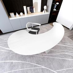 a white table sitting on top of a gray rug