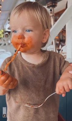 a white plate topped with spaghetti and sauce