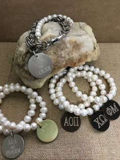 The three bracelets have been my SHOW SPECIALS this Fall at my holiday shows around the Southeast US. They are stretchy freshwater pearl bracelets that feature one of the three discs...silver, gold or antique brass. Engraved with your initials...just choose your finish and font! Wonderful bridesmaid gifts and also great for Sorority Lil Sis/Big Sis gifts. Elegant Engraved Beaded Bracelets As Gift, Elegant Hand Stamped Name Bracelet For Anniversary, Elegant Hand Stamped Bracelets For Anniversary, Elegant Hand Stamped Silver Name Bracelet, Elegant Engraved Name Bracelet For Bridesmaid, Elegant Engraved Bracelets For Bridesmaid Gift, Elegant Engraved Charm Bracelet For Wedding, Elegant Silver Name Bracelet For Bridesmaid Gift, Elegant Engraved Wedding Charm Bracelet