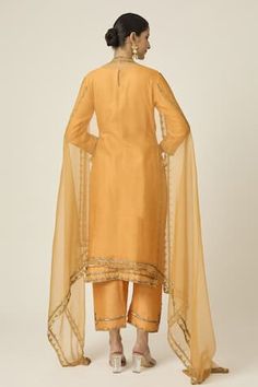 Amber yellow kurta with floral sequin, cutdana and bead embroidery. Paired with an embroidered pant and dupatta with embroidered border. - Aza Fashions Organza Kurta With Gota Work, Fitted Anarkali Set With Gota Work, Fitted Cotton Silk Kurta With Gota Work, Cotton Silk Fitted Churidar With Gota Work, Fitted Cotton Silk Churidar With Gota Work, Tissue Silk Palazzo Set With Mirror Work, Fitted Tissue Silk Kurta With Gota Work, Fitted Raw Silk Palazzo Set With Gota Work, Fitted Cotton Silk Palazzo Set With Gota Work