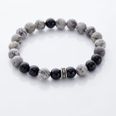 Made from entirely natural stones, our Kosmos Collection - inspired by the Greek word that translates to "world" - is sure to be one of your favorite bracelets, inspired by different elements of our beautiful Earth. Our ﻿Storm colorway makes darkness beautiful, bringing together a deep black with a dark grey. Subtle, y Elegant Obsidian Bracelets For Meditation, Elegant 8mm Beads Bracelet For Meditation, Spiritual Obsidian Beaded Bracelets With Natural Stones, Obsidian Bracelets With Natural Stones For Meditation, Onyx Natural Stones Bracelets, Onyx Bracelets With Natural Stones, Black Spiritual Gemstone Beaded Bracelets, Spiritual Black Beaded Bracelets With Stones, Black Bracelets With Natural Stones For Everyday