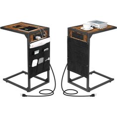 two black and brown tables with electronic devices on them