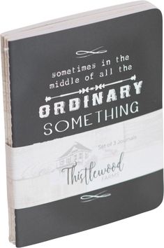 an open book with some writing on the front and back cover, in black and white