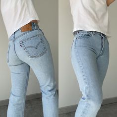 "Vintage Levi's 501 w27 L25 made in USA  stone Wash light blue faded vintage 501s Follow on Instagram for new listing  Vintage Denim Edit   100% Cotton no stretch. Please make sure size is good for you as no returns.  please read measurements before buying and ask any questions no returns Ask questions if you need help please don't buy without checking.  Measurements taken laying flat.  please read measurements below before buying   Lovely light blue USA button 524 Cut at hem  Waist 35cm/13.7\" across flat (The 27.5\"total) Crotch to waist 28.5cm 11.2\" Hips 53cm\" across flat 20.8\" total 41.7\"  Thigh across flat 27cm/10.6\" across  inside leg from crotch 63cm 25\"  Ankle 18.5cm/ 7.2\" across flat  If you have a pair of vintage Levi's compare measurements to get the best fit. Also always 501 Outfit, Levis 501 Women, Light Wash Levis, Jean Vintage, Vintage Levis 501, Levi’s 501, Black Long Sleeve Top, Follow On Instagram, Levi's 501