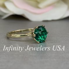 "The ring pictured is lab created emerald #5837 Also Shown in 14k White Gold -Approximate total carat weight: approx. 1.90ctw diamond equivalent -Center Stone Size: 8mm - approx. 1.90ct diamond equivalent -Center Stone Shape: round / rose cut -Gem Type: lab created emerald -Stone Clarity: VS2 -Stone Color: Green -Moh's Scale: 8x.5 hardness -Metal Type and Purity: 14k yellow gold -Setting: 6 prong crown head -Stock Ring Size: 6 -Country of Manufacturing: USA (Michigan) For customization please co Timeless Emerald Anniversary Ring, Timeless Emerald Wedding Anniversary Ring, Elegant 14k Stamped Emerald Ring, 14k Gold Emerald Ring For Proposal, Fine Jewelry Emerald Ring For Proposal, Heirloom Emerald Cut Solitaire Birthstone Ring, Timeless Green Wedding Rings For Anniversary, Classic Emerald Diamond Promise Ring, Emerald Solitaire Diamond Ring For Proposal