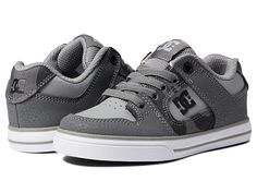 DC Kids Pure Elastic (Little Kid/Big Kid) - Boys Shoes : Grey/Camo : Featuring a durable leather and canvas upper, elasticized laces, and a classic round-toe silhouette, these DC Pure Elastic skate shoes will keep them on their feet from kickflip to toe flip. These go-everywhere sneakers boast a padded tongue and comfort collar, breathable mesh lining and low-key logo on side panel. Toe-cap overlay boasts ventilation holes for breathable wear. Vulcanized construction offers better board feel, si Dc Pure, Key Logo, Grey Camo, Shoes Grey, Leather And Canvas, Soft Shoes, Kid Character, Dc Shoes, Boy Shoes