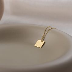 Stylish and minimalist 14K gold personalized rectangle necklace for everyday wear. Great for layering.  Unique personalized gift idea to show love to the important people in your life with a cute, dainty, and creative gift. Customized rectangle tag necklace makes a perfect birthday gift for mothers, friends or yourself.  A special anniversary gift for significant others. Just engrave his/her name. It is a perfect gift. It can be dressed up or dressed down depending on the situation. We only use Modern Gold Initial Necklace Gift, Minimalist Square Pendant Necklace As Gift For Her, Minimalist Yellow Gold Initial Necklace For Personalized Gift, Square Pendant Initial Necklace Gift, Minimalist Gold Name Necklace, Minimalist Rectangular Necklace As Gift For Her, Classic Gold Rectangular Charm Necklace, Minimalist Rectangular Necklaces As Gift For Her, Tarnish Resistant Square Pendant Initial Necklace For Gift