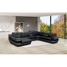 a modern living room with black leather furniture