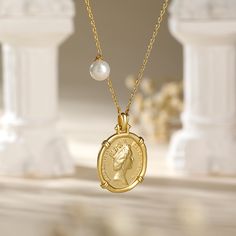 Carry a little history with our beloved Queen Elizabeth II Portrait Coin Pendant Necklace. This unique and modern designed sterling silver necklace is versatile and reversible to suit every occasion. It has a Queen Elizabeth portrait on one side, and the "Saint George Killing the Dragon" on the other. It is easy to coordinate with your outfits and other jewelry without having to overthink it. Just put it on and you are good to go!Carat Weight: 1.5 ctStone Shape: RoundStone Size: 6 mmNumber of St Classic Necklace With Coin Pendant, Classic Sterling Silver Tarnish-resistant Necklace, Timeless Sterling Silver Necklace With Coin Pendant, Classic Sterling Silver Necklace With Coin Pendant, Classic Coin Necklaces, Classic Silver Necklace With Coin Pendant, Luxury Silver Coin Necklace Tarnish Resistant, Sterling Silver Medallion Necklace With Pearl Pendant, Luxury Silver Tarnish Resistant Coin Necklace