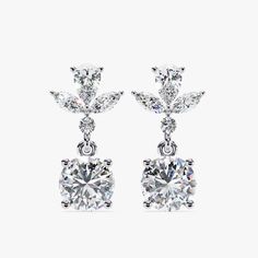 Introducing our exquisite 1.15 CT Dangle Stud Lab Grown Diamond Earrings, a perfect blend of sophistication and modern style. These earrings feature a stunning arrangement of marquise and round-cut diamonds, meticulously set to dangle gracefully. Crafted in luxurious 14k gold with a secure pushback closure, these dangle drop earrings offer both elegance and comfort. Ideal as a dazzling birthday gift or a special treat for her, these earrings are designed to captivate and charm, making every mome Celebration Diamond Drop Earrings, Fine Jewelry Bridal Drop Earrings, Fine Jewelry Bridal Drop Earrings With Brilliant Cut, Formal Bridal Gemstone Drop Earrings, Formal Bridal Drop Earrings With Gemstones, Exquisite Brilliant Cut Dangle Earrings, Exquisite Dangle Earrings, Anniversary Cluster Drop Earrings In Cubic Zirconia, Gift Brilliant Cut Cubic Zirconia Chandelier Earrings