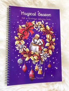 a purple christmas card with an image of a bird in a wreath and bells on it