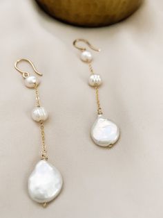 These are perfect for wear every day, with our 3 Pearl dangle earrings you are elegant with them. Is fashionable at any time. If you like simple, classy, and Unique jewelry, these earrings are perfect for you. They make elegant, versatile earrings. Details: - material: 14k gold-filled 14k rose gold-filled sterling silver - measure: 3 inches - Gems: freshwater round pearl and coin pearl (free-form) ADDITIONAL INFORMATION These earrings have been created by hand so no two pieces are identical. Eac 14k Gold Dangle Pearl Earrings, Rose Gold Dangle Pearl Earrings In Sterling Silver, Rose Gold Sterling Silver Dangle Pearl Earrings, 14k Gold Dangle Linear Earrings With Pearl Drop, Elegant Teardrop Everyday Jewelry, Everyday Rose Gold Jewelry With Matching Earrings, Graceful Drop Earrings Jewelry Gift, Handmade Elegant Dangle Threader Earrings, Graceful Drop Earrings With Matching Set