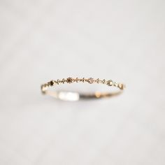 a close up of a ring on a white surface