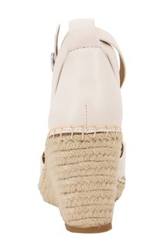 An earthy espadrille-style wedge keeps your look warm-weather ready in a stylish leather sandal complete with a well-cushioned footbed for endless comfort. 3" heel Multilayered, PORON®-cushioned footbed Leather upper and lining/rubber sole Imported Natural Leather Wedge Sandals With Cushioned Footbed, Natural Synthetic Espadrilles With Cushioned Footbed, Beige Wedge Sandals With Leather Footbed, Beige Wedge Sandals With Leather Footbed And Round Toe, Beige Round Toe Wedge Sandals With Leather Footbed, Natural Color Casual Wedge Sandals With High Heel, Natural Leather Wedge Heels, Casual Natural High Heel Wedge Sandals, Closed Toe Straw Wedge Sandals With Cushioned Footbed