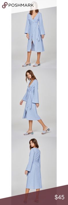 The Fifth Label Long Sleeve Striped Wrap Dress Relaxed fit midi wrap dress from The Fifth Label -Wrap front with ties and internal button closure -Flared sleeve -Lightweight woven stripe fabric -Model is 5’7” & wearing Size S -79% cotton, 21% polyester  -Brand new in package The Fifth Label Dresses Midi Spring Blue Wrap Dress With Surplice Neckline, Blue Wrap Dress For Beach, Blue Tie Waist Wrap Dress For Spring, Spring Midi Dress With Tie Waist For Brunch, Spring Long Sleeve Wrap Dress For Daywear, Spring Brunch Midi Dress With Tie Waist, Spring Blue Wrap Dress With Tie Waist, Blue Wrap Dress With Tie Waist For Spring, Spring Wrap Dress With Surplice Neckline For Day Out