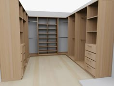 an empty walk in closet with shelves and drawers