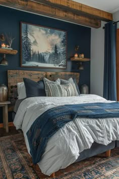 a large bed sitting in a bedroom next to a painting on the wall above it