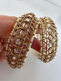 Gorgeous Polki bangles with antique gold plating. Comes as a pair Color-Antique gold  Opening: Screw Type   Beautiful pair of bangles handcrafted by our in-house karigars Polki Bangles, Pearl Bangles, Kundan Bangles, Pearl Bangle, Bangles Indian, Antique Finish, Indian Jewelry, Gold Plating, Antique Gold