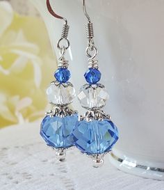 Beautiful blue and white dangle earrings are sure to look fabulous with any outfit, dress them up or wear with your favorite jeans! Made with faceted glass beads and silver accents. Earrings measure 1 1/4 inches. Blue Drop Crystal Earrings, Blue Crystal Drop Earrings, Nickel Free Blue Crystal Earrings, Nickel-free Blue Crystal Earrings, Elegant Blue Faceted Beads Earrings, Blue Dangle Crystal Earrings With Faceted Beads, Elegant Blue Crystal Earrings With Faceted Beads, Elegant Blue Faceted Crystal Earrings, Blue Sterling Silver Earrings With Faceted Beads