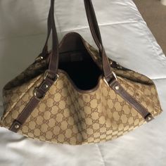 Beautiful Comfortable Authentic Used Gucci Hobo Bag. Used With Love. Gold Tone Hardware. See Pics For Wear Marks. Purchased At Neiman Marcus Boston. Pre-owned Brown Monogram Canvas Bag, Designer Pre-owned Shoulder Bag, Pre-owned Gucci Shoulder Bag For Travel, Pre-owned Tote Shoulder Bag For Shopping, Pre-owned Classic Gucci Bags, Pre-owned Designer Brown Bags, Elegant Pre-owned Tote Shoulder Bag, Pre-owned Gucci Leather Bag, Pre-owned Brown Leather Shoulder Bag For Daily Use