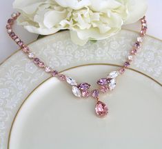 Rose gold Bridal necklace with Blush Swarovski crystals | Etsy Elegant Pink Jeweled Necklaces, Elegant Pink Necklace With Jewels, Rose Gold Crystal Necklaces For Wedding, Pink Jeweled Wedding Jewelry, Elegant Rose Gold Crystal Necklace For Wedding, Elegant Pink Crystal Necklaces For Weddings, Pink Crystal Wedding Necklaces, Elegant Pink Bridal Necklace With Jewels, Pink Crystal Wedding Necklace