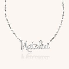 With subtle and graceful personalized script details, the Natalia captures the essence of Everyday Extraordinary in all the right ways. Classic Nameplate Necklace For Wedding, Classic Wedding Nameplate Necklace, Classic White Gold Name Necklace As Gift, Engraved White Gold Custom Nameplate Necklace, Elegant Silver Necklace For Personalized Gift, Signature Engraved Jewelry For Anniversary, Elegant Sterling Silver Nameplate Necklace, Sterling Silver Nameplate Necklace For Wedding, Luxury Sterling Silver Name Necklace For Formal Occasions