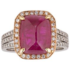 A rare Burma cabochon ruby positively captivates amid a halo of diamonds in this extraordinary ring. The exceptional jewel weighs 6.31 carats and its sugarloaf cut perfectly showcases the intense red hue for which Burma rubies are so coveted. Certified by C. Dunaigre Switzerland as a natural, no-heat ruby, the gem is encircled by 26 sparkling round diamonds set in 18k yellow gold, enhancing the stone’s unique color. Additional diamonds are embedded in the ring’s platinum band, adding further luxury to this exquisite piece. Gold Filigree Necklace, White Gold Diamond Wedding Rings, Dazzling Jewelry, Ruby And Diamond Necklace, Cabochon Ruby, Ruby Rings, Diamond Cluster Earrings, Vintage Cocktail Ring, Ruby Diamond Rings