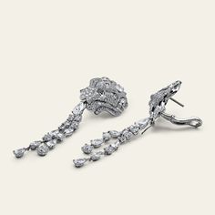 Chanel Lion Royal Earrings, Medium Version, White Gold, Diamonds Details 18k White Gold 1 Pear Cut Diamond .75cts (E-VVS2) 1 Pear Cut Diamond .75cts (F-IF) 28 Fancy Cut Diamonds 6.77cts (F+ - VVS+) 472 Round-Cut Diamonds 4.03cts (F-G - VVS1/2) *Comes with original box and certificate. *These Chanel earrings are unique. UK retail £175,000 with vat. UK retail £145,000 without vat.Product Number: J60875 Luxury Diamond Cluster Earrings With Baguette Diamonds, Luxury White Gold Cluster Earrings With Baguette Diamonds, Luxury Baguette Diamond Earrings For Formal Events, Platinum Bridal Earrings With Diamond Accents For Evening, Luxury Platinum Baguette Diamond Earrings, Luxury Diamond White Platinum Cluster Earrings, Luxury Platinum Diamond Earrings With Baguette Diamonds, Luxury Platinum Cluster Earrings In Diamond White, Luxury Diamond Cluster Earrings For Formal Occasions