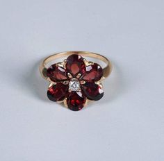 "Metal: Yellow Gold Ring Size: 7.25 Main Stone: Garnet Main Stone Shape: Pear Metal Purity: 14k Main Stone Color: Red This is a 5 Gram 14K Yellow Gold Floral Design Garnet and Diamond Ring, size 7.25. It is pre owned but shows little if any wear. Stock # WT016R08Most rings are sizable for a small fee. If the ring you are considering is the incorrect size contact us for a quote.Payment Through Paypal within 3 days of purchase. I ship to U.S addresses only. No international shipping. Returns accep Garnet And Diamond Ring, Garnet Engagement Ring, I Love Jewelry, Fine Jewelry Designers, Yellow Gold Earring, Garnet Rings, Yellow Gold Ring, Gold Floral, Yellow Gold Rings