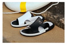 Looking for a stylish and versatile pair of sliders that are perfect for both formal and casual occasions? Look no further than our elegant slip-on sliders, available in black and white or brown and white. Whether you're dressing up for a formal event or keeping it casual for a day out with friends, these sliders will complement any outfit. The black and white or brown and white color options ensure that they will match any color scheme. Invest in these elegant slip-on sliders today and elevate Black Synthetic Slip-ons For Summer, Black Open Toe Slip-ons, Formal Open Toe Slippers For Summer, Elegant Open Toe Slip-ons For Summer, Elegant Black Slip-ons For Summer, Black Slide Sandals For Formal Wear, Black Slide Sandals For Formal Occasions, Elegant Black Slide Sandals, Formal Slide Sandals For Summer