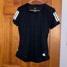 Women’s Adidas Athletic Top. Perfect For Gym Or Athleisure Wear. Mess Detailing On Shoulders And Top Of Back. Perfect Condition. Never Worn! Moisture Wicking Material. Sporty T-shirt With Three Stripes For Sports, Adidas Sportswear T-shirt For Gym, Sportswear T-shirt With Three Stripes For Workout, Workout T-shirt With Adidas Branding, Black Sporty T-shirt With Athletic Fit, Adidas Three Stripes Workout T-shirt, Adidas Activewear With Athletic Fit And Short Sleeve, Adidas Logo Athletic Fit Short Sleeve Activewear, Sporty Athletic Fit T-shirt For Sports