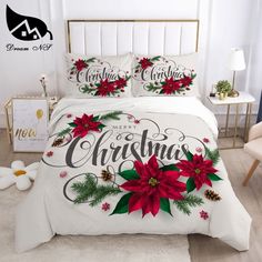 a christmas themed bed with poinsettis and pine cones