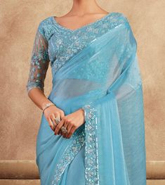 COLOR : Sky Blue FABRIC : Saree - Chiffon Silk, Blouse - Chiffon Silk & Net WORK : Resham Embroidery, Stones, Sequins, Lace BorderOCCASION : Wedding, Engagement, Party Wear, Festival, Sangeet NOTE : The outfit includes blouse and saree only. Petticoat is not included. READY-TO-WEAR : No STITCHING : Available as semi-stitched fabric, can be stitched using standard size option (+$30). Note: There might be a slight color variation due to lighting and flash used during photoshoot. The bright shade s Embroidery Stones, Ethereal Sky, Blue Wedding Party, Sky Blue Wedding, Sky Blue Weddings, Sky Blue Fabric, Blouse Chiffon, Saree Chiffon, Resham Embroidery